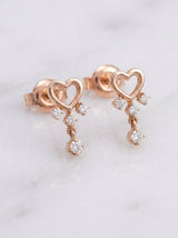 Orecchini in oro rosa a cuore con 4 diamanti pendenti ct. 0,16 G-SI au gr.1,8