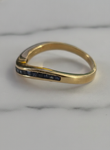 Anello riviera a onda in oro giallo e zaffiri blu ct.0,62 gr.3,7