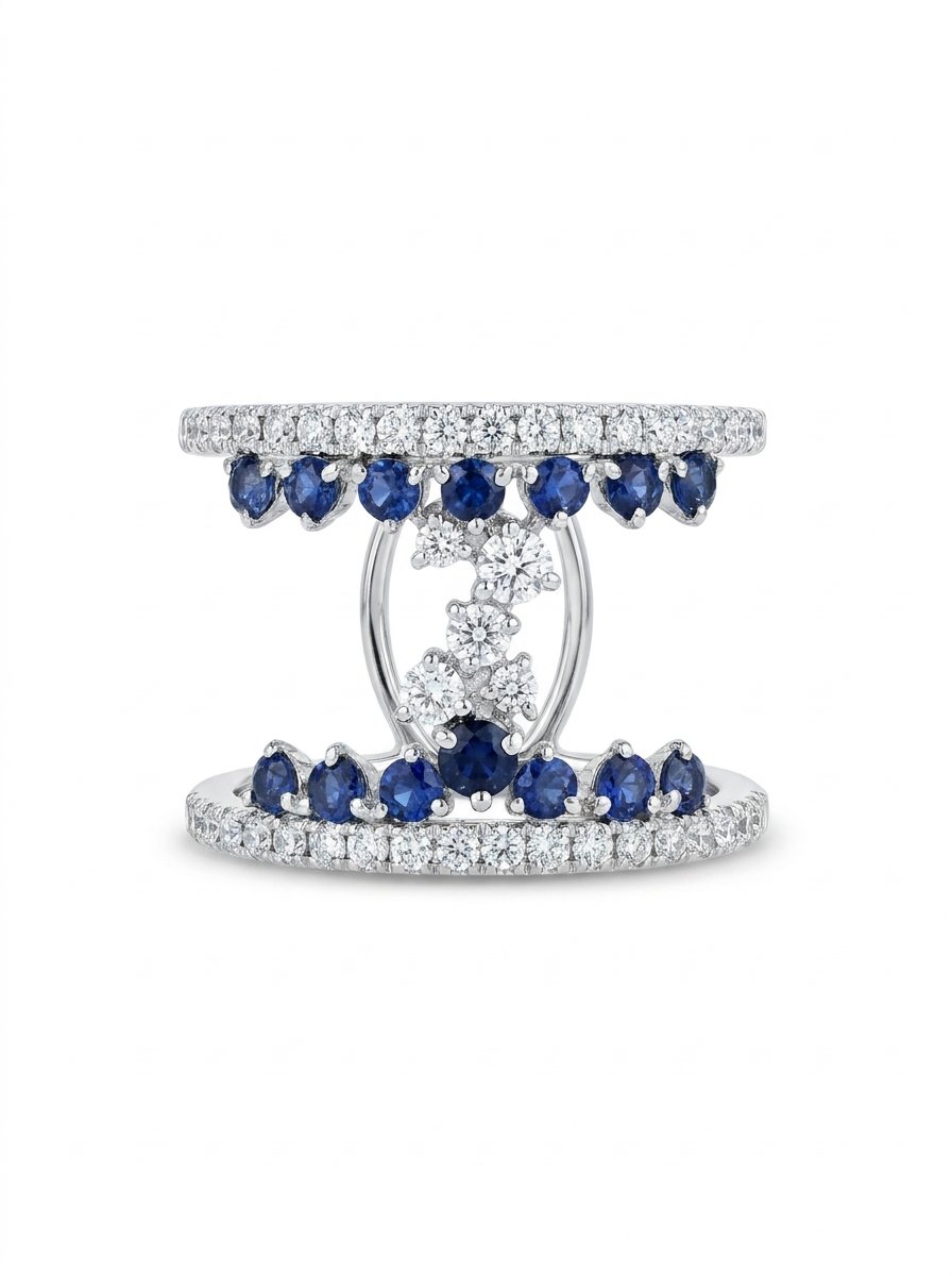 Anello fascia in oro bianco diamanti ct. 0,64 F-VS zaffiri blu ct. 0,65 gr. 4,8 due file di diamanti e zaffiri che tengono sospeso un gioco centrale di cinque diamanti