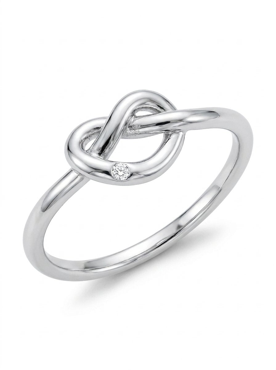 Anello nodo in oro bianco con diamante bianco ct. 0,01 gr. 2,4