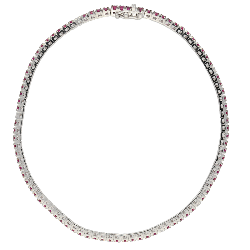 Bracciale tennis in oro bianco e rubini con spot di diamanti bianchi